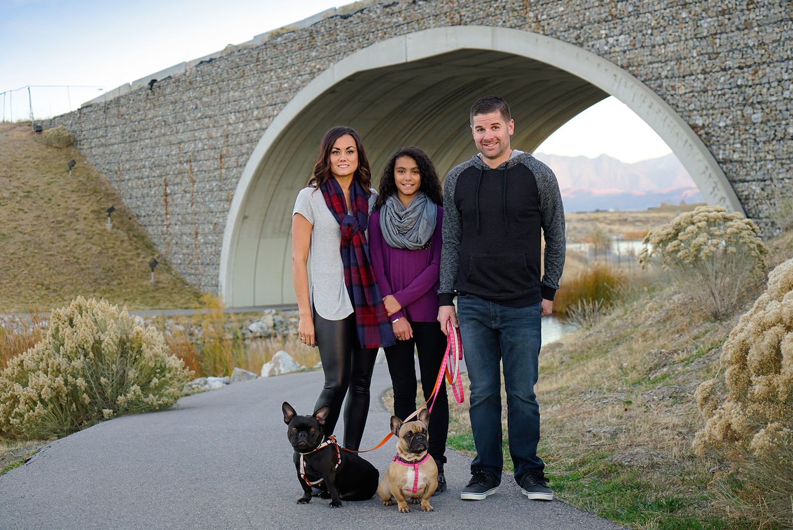 humbirdphoto - Photo of family with two french poodles undera a bridge