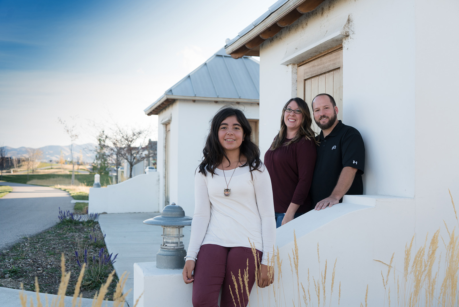 humbirdphoto - Photo of family next to a white shed