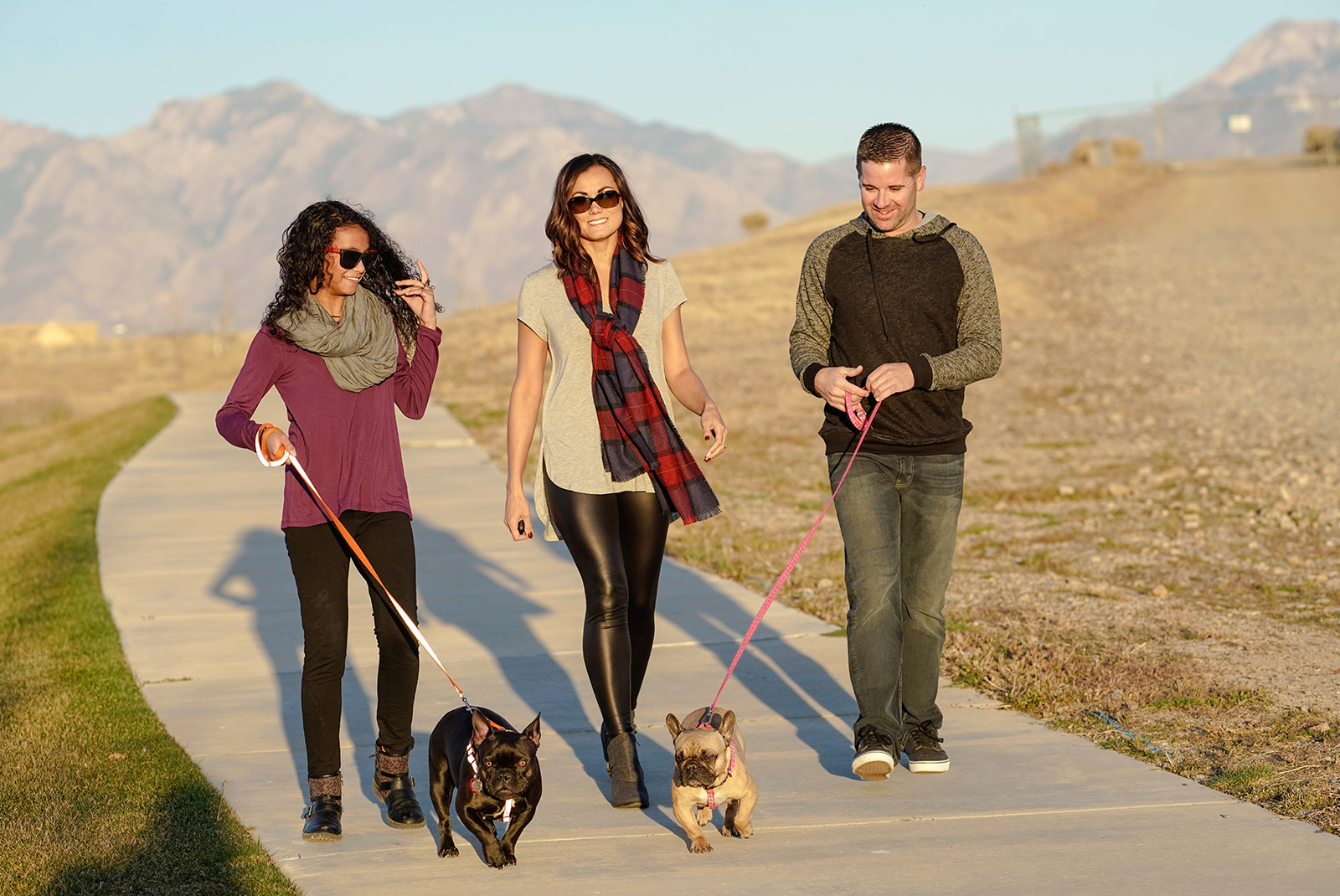 Photo of family walking thier two dogs