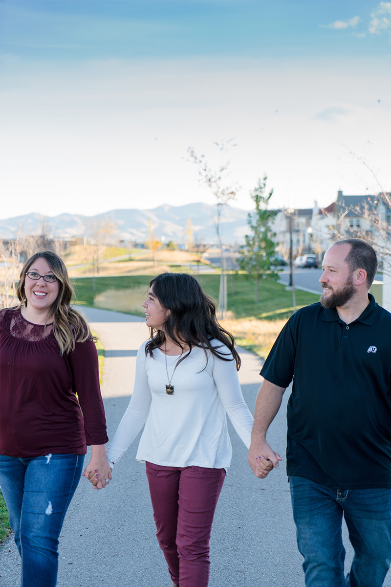 humbirdphoto - Photo of family holding hands walking on a sidewalk